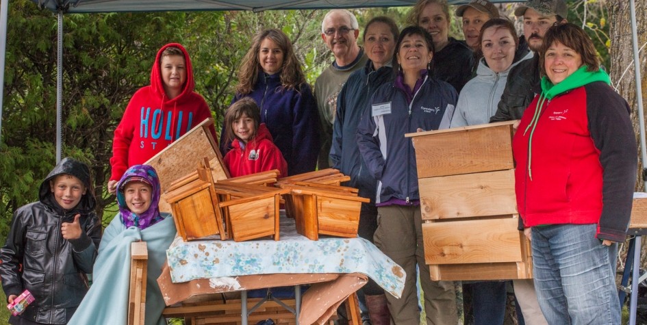 photo of volunteers with complete bird and bat housees