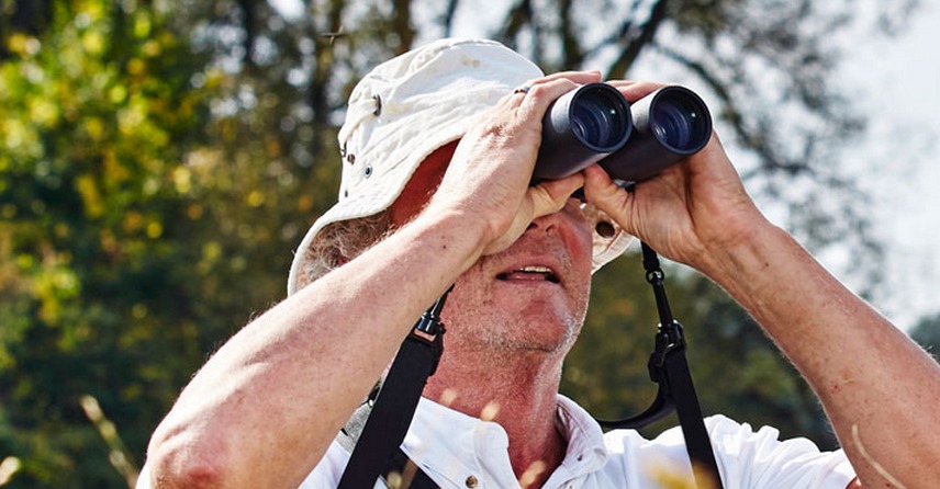 Image of David Science looking through bonoculars