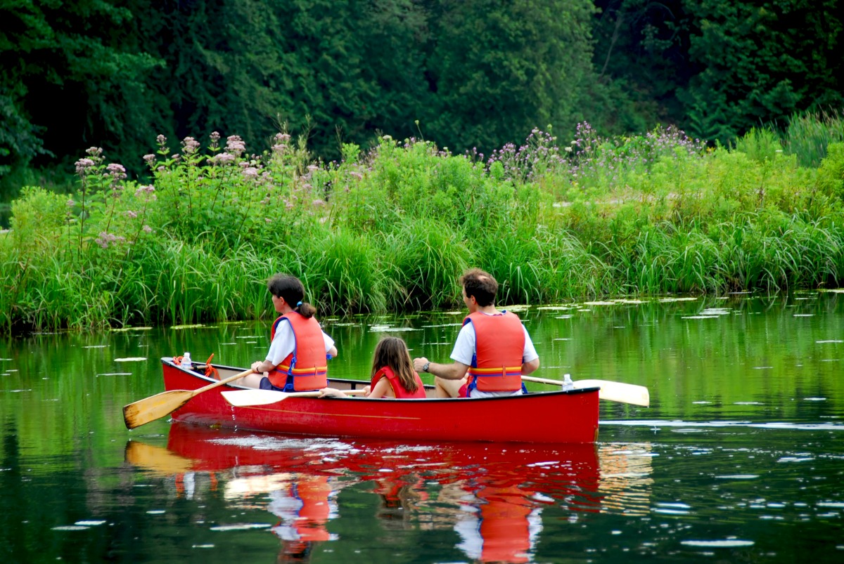 Image of family canoeing on a lake