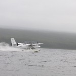 Float plane arriving at start of canoe adventure