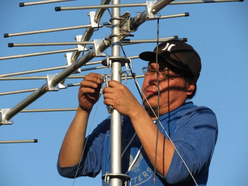 Image of a man installing a tower