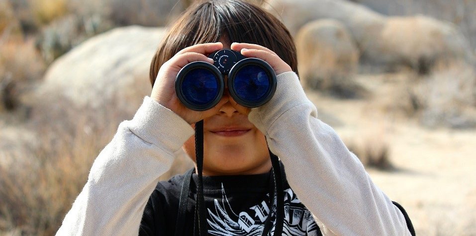 Image of a boy with binoculars